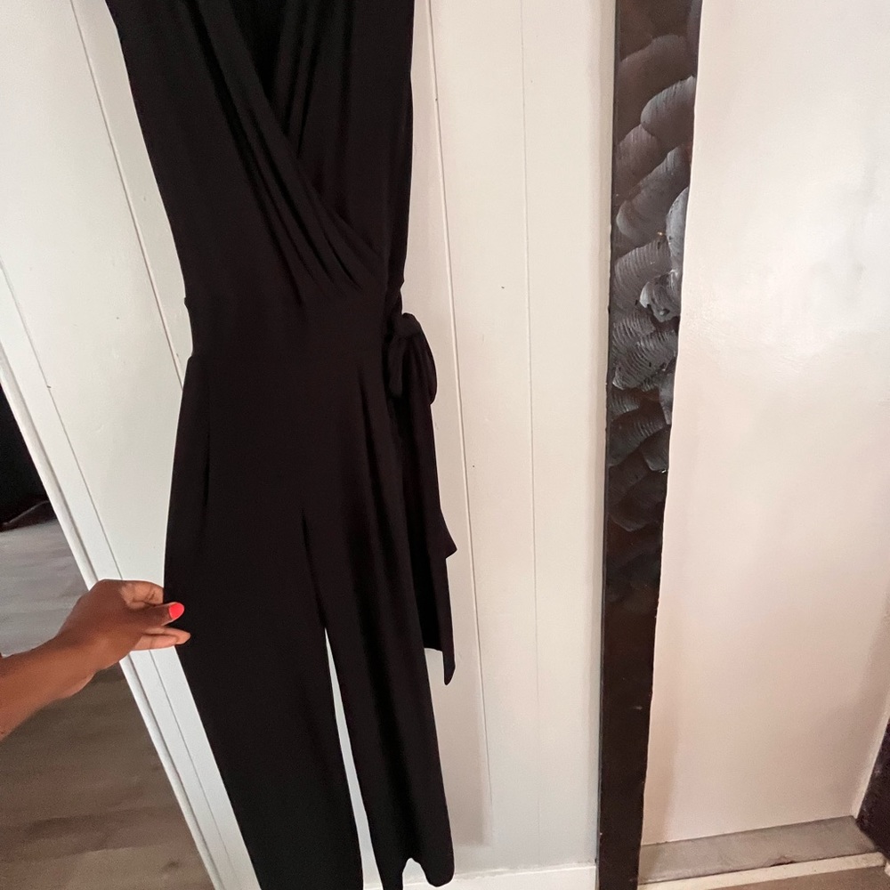 New York and Company black one piece jumper with belt.